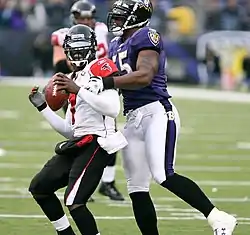 Vick with Baltimore's Terrell Suggs