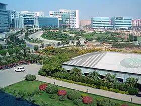 City panorama showing gardens, clean roads and modern office buildings