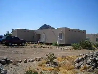 A modern "triple wide" home, designed to look like an adobe home