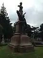 Memorial statue for Russell located at East Finchley Cemetery