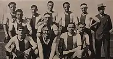 Eleven players of Monza and their head coach in three rows wearing a white kit with a red vertical stripe facing the camera