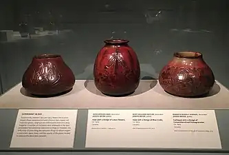 Examples from Smithsonian Traveling Exhibition showing a rare copper red reduction glaze