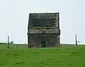 Ruined doocot at Newbigging near Aberdour, Scotland, revealing the nesting boxes