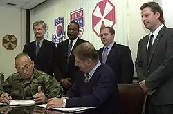 Image 33National Federation of Federal Employees officials sign a collective bargaining agreement with the U.S. 8th Army in October 2002.