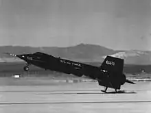 X-15 touching down on its skids, with the lower ventral fin jettisoned.