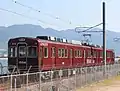 An ex-Nose Electric Railway 1500 series converted to a "MIHARA-Liner" test train at Mitsubishi Heavy Industries's test track at Mihara