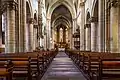 Inside view towards the choir. Opposite the pulpit is the tabernacle.