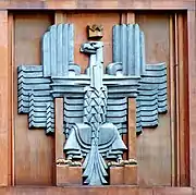 Polish coat of arms (unofficial) in Art Deco style, on the facade of the post office in Warsaw (architect Julian Puterman-Sadłowski 1934).