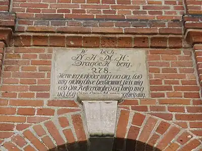 Detail of the sandstone tablet above the main entrance.