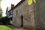 Odda's Chapel, Deerhurst, attached to later house.