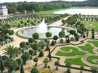 Image 3The Orangerie in the Gardens of Versailles with the Pièce d’eau des Suisses in the background (French formal garden) (from List of garden types)