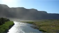 The Orange River on the border bridge between Noordoewer and Vioolsdrif. Extreme heat and sunlight cause visible evaporation.