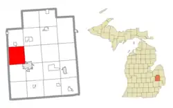 Location within Lapeer County (red) and an administered portion of the village of Columbiaville (pink)