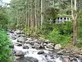 Castle-style house, long under construction along the Caldera River