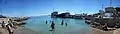 Panoramic image of the beach and harbor of Skala