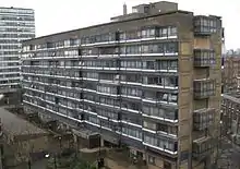 A view with showing the distinctive 'half floor' arrangement between the internal walkways (shown by the end windows) and the accommodation floors (shown by the side windows)