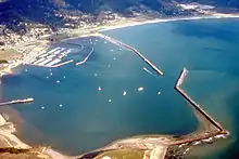 Aerial view of Pillar Point Harbor looking east. The 1967 breakwater extension is at the center right; the 1982 inner breakwater is at the upper left