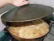 Pilaf (palaw) being prepared in a qazan.