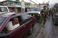 Image 46U.S. Marines patrol the streets of Port-au-Prince on 9 March 2004 (from History of Haiti)