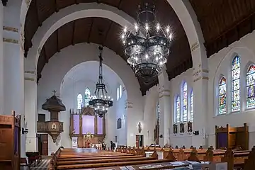 Interior, note the secessionist furniture and metallic wall ornaments.