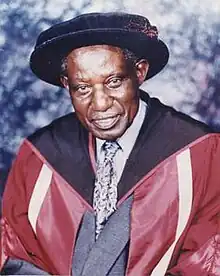 A portrait of Wasawo in formal academic attire