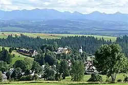 Village center with local Catholic church and Tatras