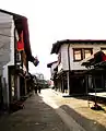 Bazaar of Peja shown with many shops closed on a Sunday