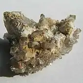 A cluster of transparent and light brown quartz crystals.