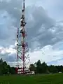 Lattice steel telecommunication tower; original mast (back, left); main mast (back, right)