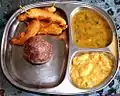 Ragi mudde and bhajji with sambar and chutney