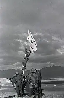 Image 29Avraham Adan raising the Ink Flag marking the end of the 1948 Arab–Israeli War (from History of Israel)