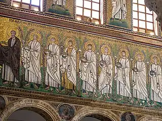 The nave as seen from an aisle, featuring a mosaic of several saints