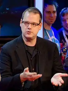 A photo of BioWare founder Ray Muzyka speaking.