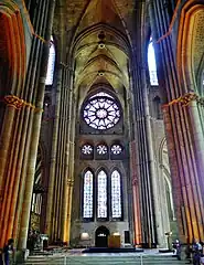 Interior of the south transept, with rose window