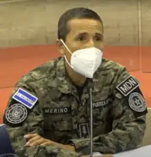 René Merino Monroy wearing a mask and presenting testimony before the Legislative Assembly regarding the events of 9F.