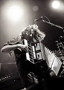 Parry performing with Arcade Fire in 2011