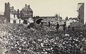 Damage near the Armory. Albumen print, 1865