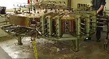 A Steinway solid wood piano case being pressed after taking from the steam box.