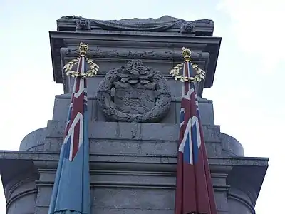 Southwest flags and carved wreath enclosing the arms of Rochdale