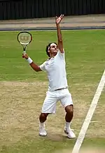 Roger Federer serving at the 2009 Wimbledon Championships.