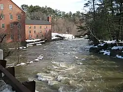 The Royal River rushing by the mill, en route to Yarmouth's First Falls