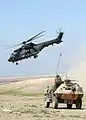 Spanish Cougar passing by a VBL of the 2e REI in Afghanistan, 2005.