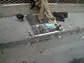 Hawker selling sanda oil in Rawalpindi, Pakistan.