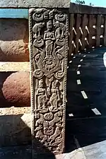 Yaksha couple standing on lotus leaves, the male (sic) holding a lotus bud and posed in shalabhanjika