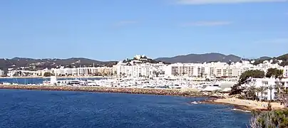 Port and town of Santa Eulària des Riu from NE.