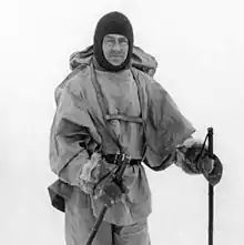 Man in winter coat wearing a balaclava or ski mask style headgear.