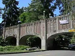 Reinforces concrete piers and arches supporting a walkway