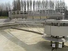 Sedimentation tank at a large scale conventional sewage treatment plant in Merchtem