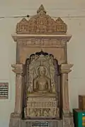 Lord Adinath, Chandella period, shrine 6 (Note Navagraha, Sarvanha and Chakreshwari in the platform.)