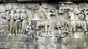 Old stone carving of the Buddha with his servants and horse